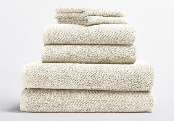 https://www.satarahome.com/cdn/shop/products/satara-home-organic-all-natural-coyuchi-air-weight-bath-towels-undyed-image_2000x.jpg?v=1617899093